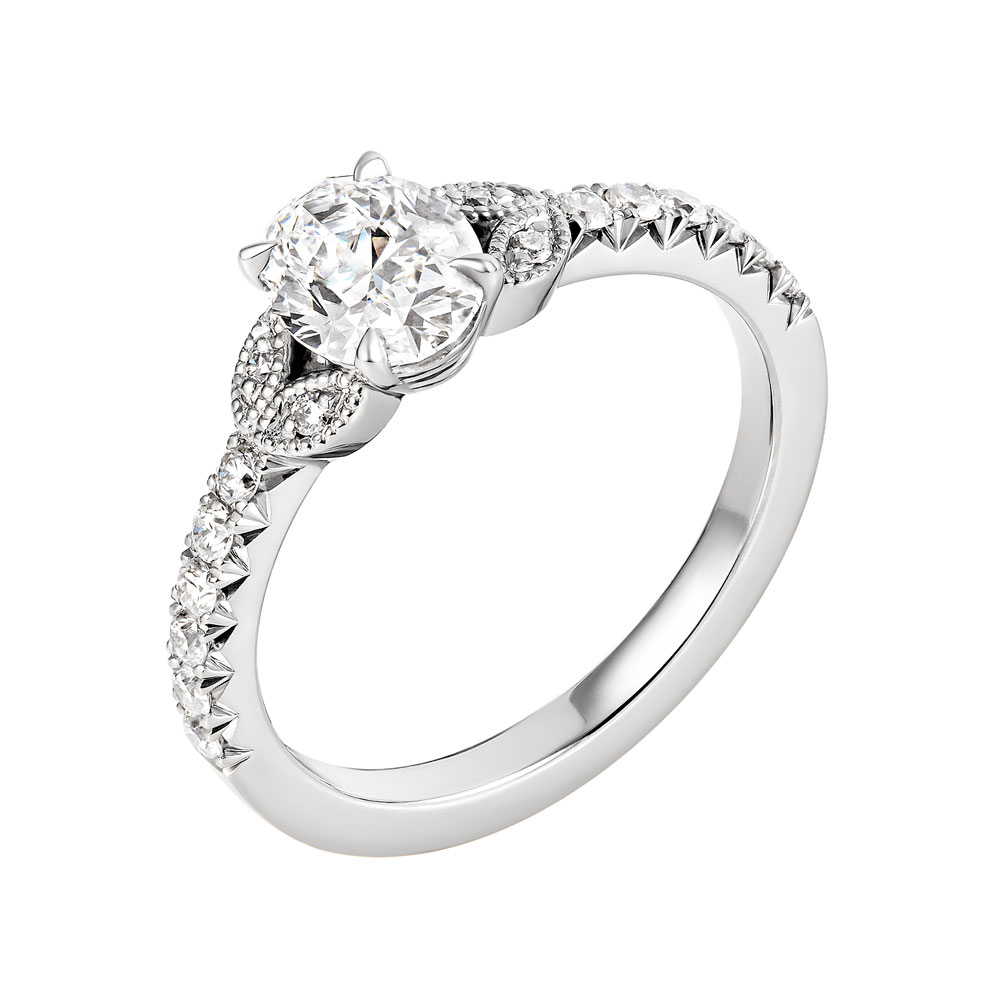 Leah-vintage-oval-platinume-halo-diamond-engagement-ring-angle.jpg